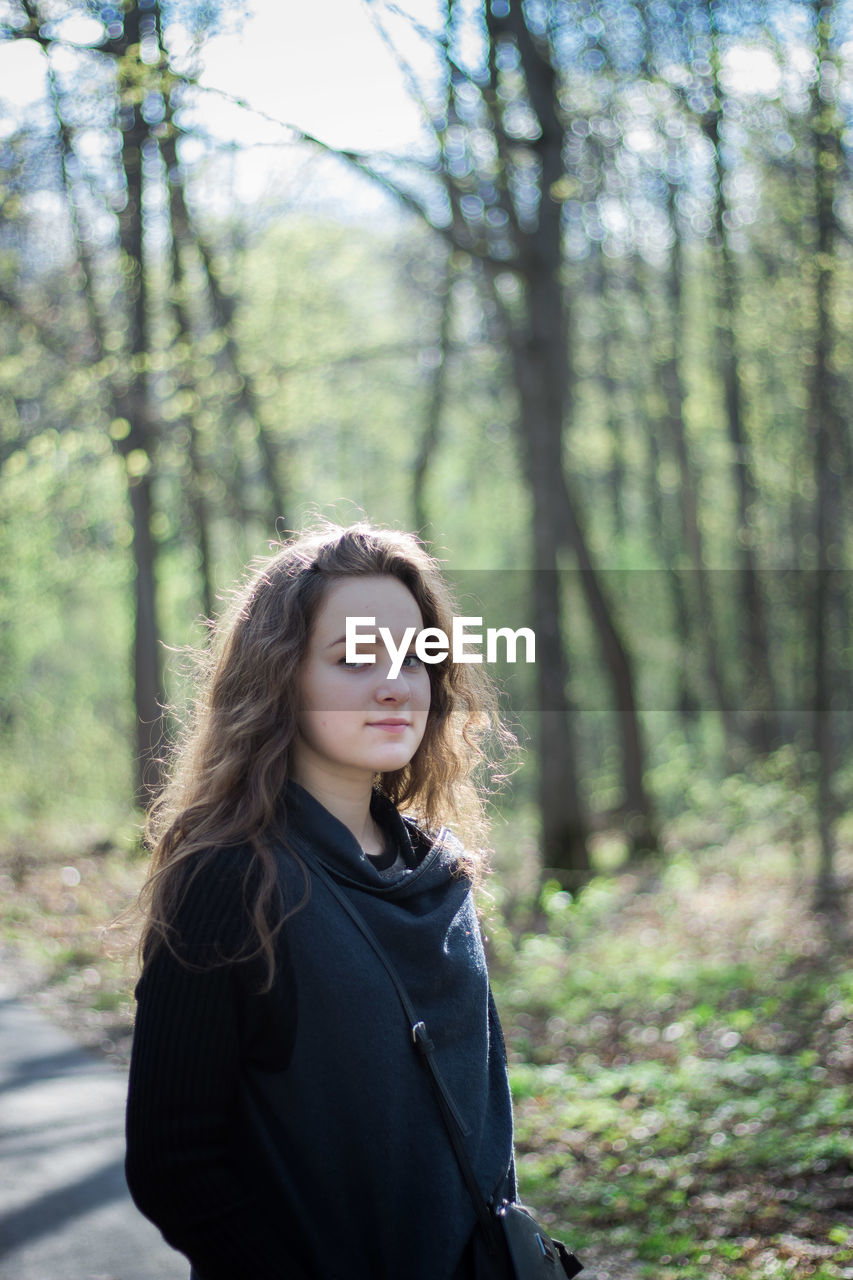 Portrait of young woman in forest