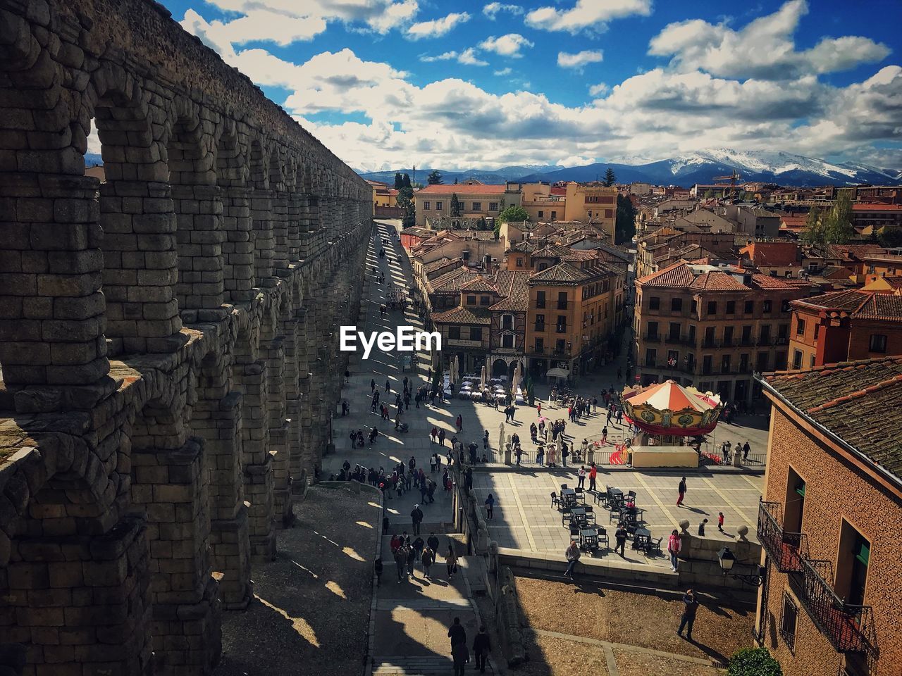 High angle view of aqueduct in city against sky