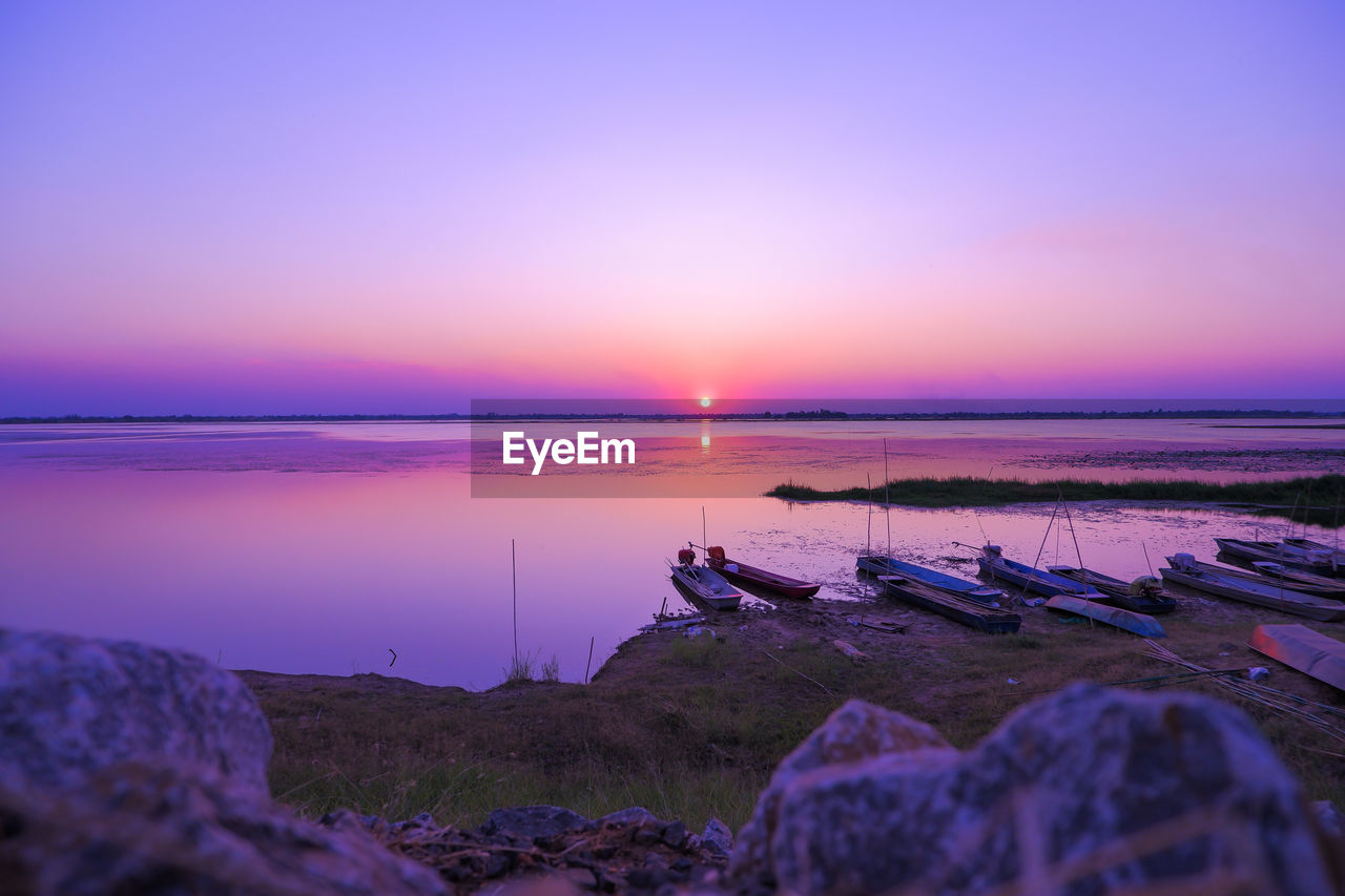 SCENIC VIEW OF BEACH DURING SUNSET