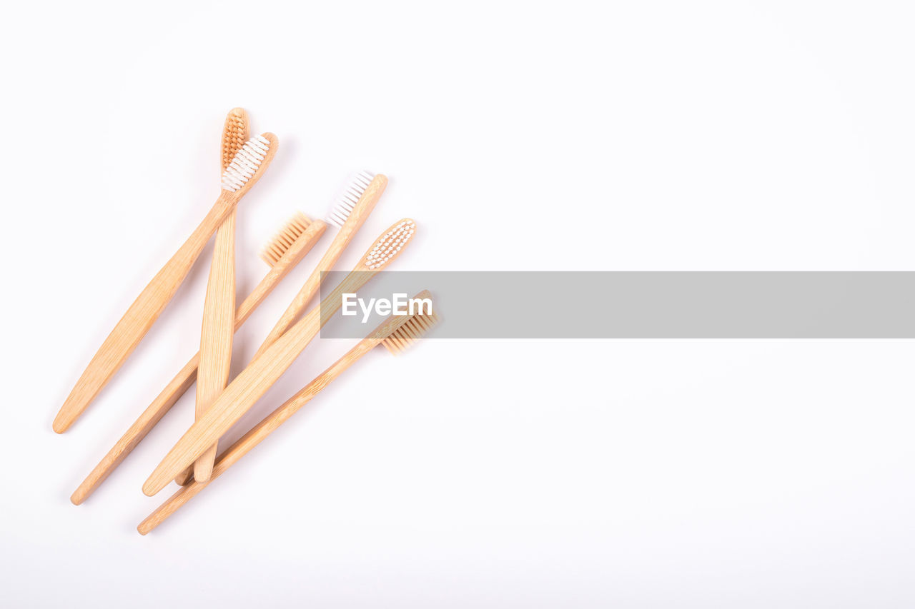 Top view of bamboo toothbrushes isolated on white background. flat lay. zero waste eco life concept
