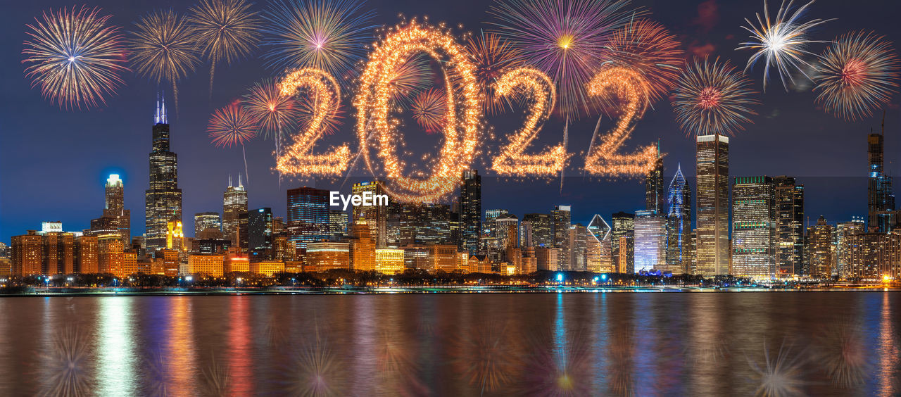 2022 written with sparkle firework with multicolor of fireworks on panorama scene of chicago