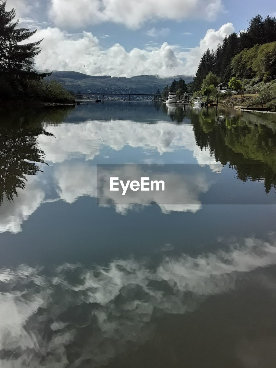 SCENIC VIEW OF LAKE AND CLOUDS AGAINST SKY