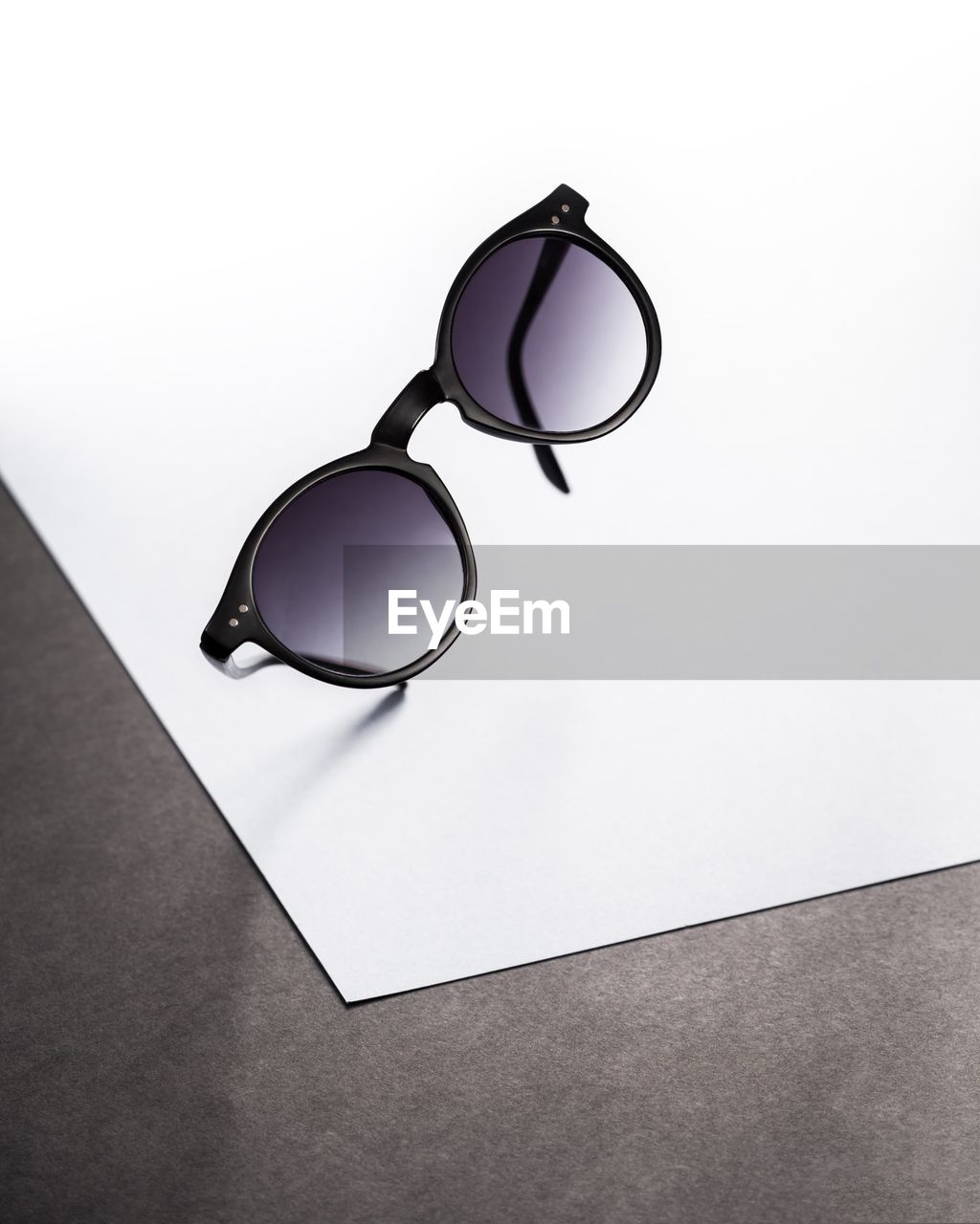 Sunglasses on paper