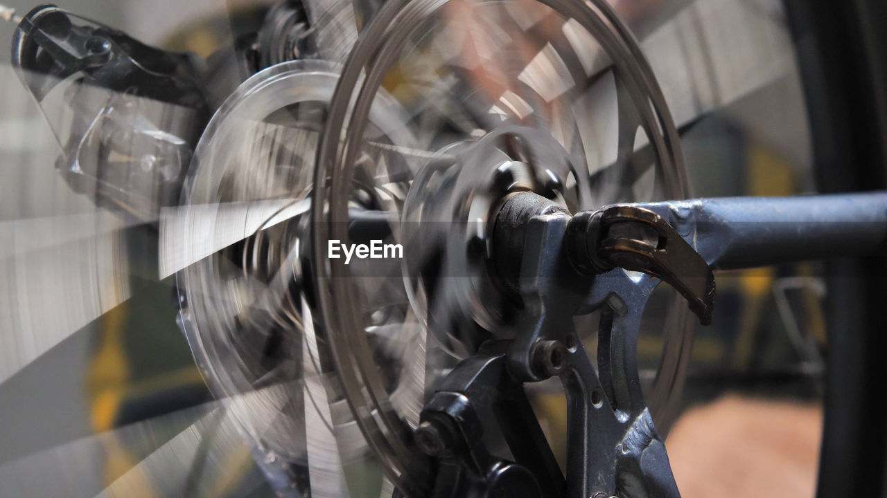 bicycle, vehicle, wheel, close-up, indoors, transportation, metal, business, technology, no people, focus on foreground, mode of transportation, machinery