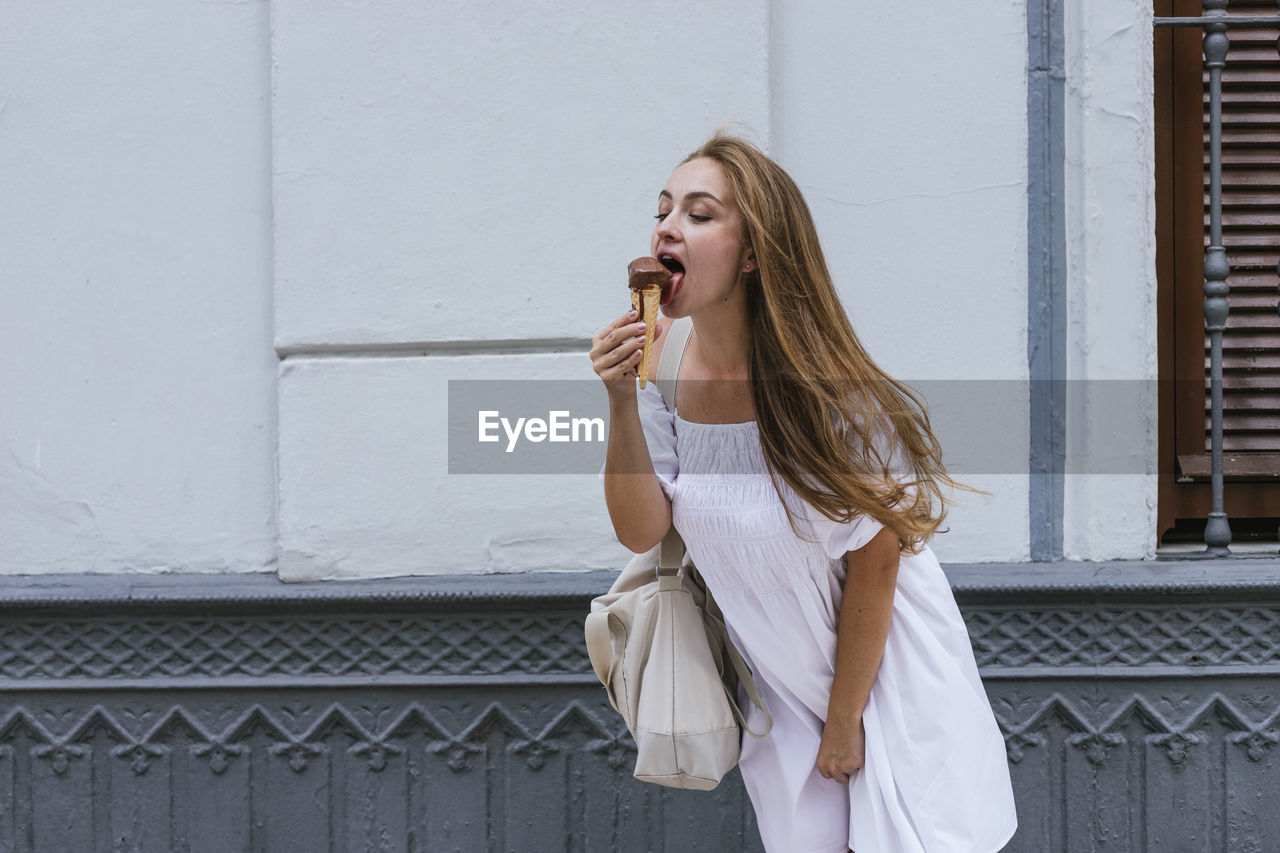 Caucasian white woman having ice cream