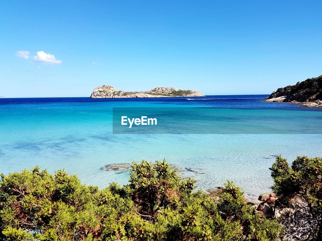 Scenic view of sea against blue sky