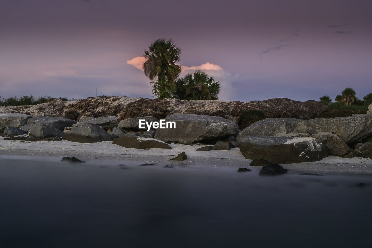 Scenic view of sea against sky at sunset