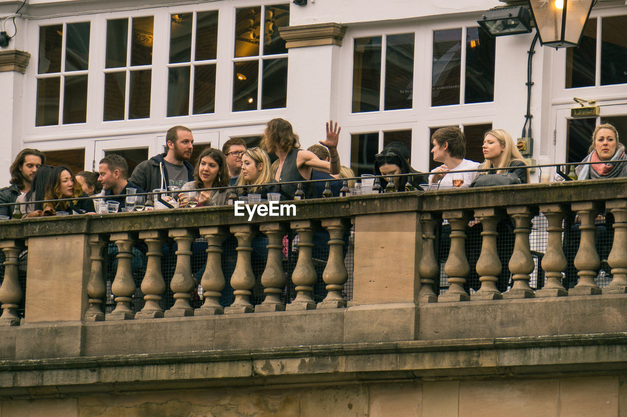 PEOPLE AT MARKET STALL