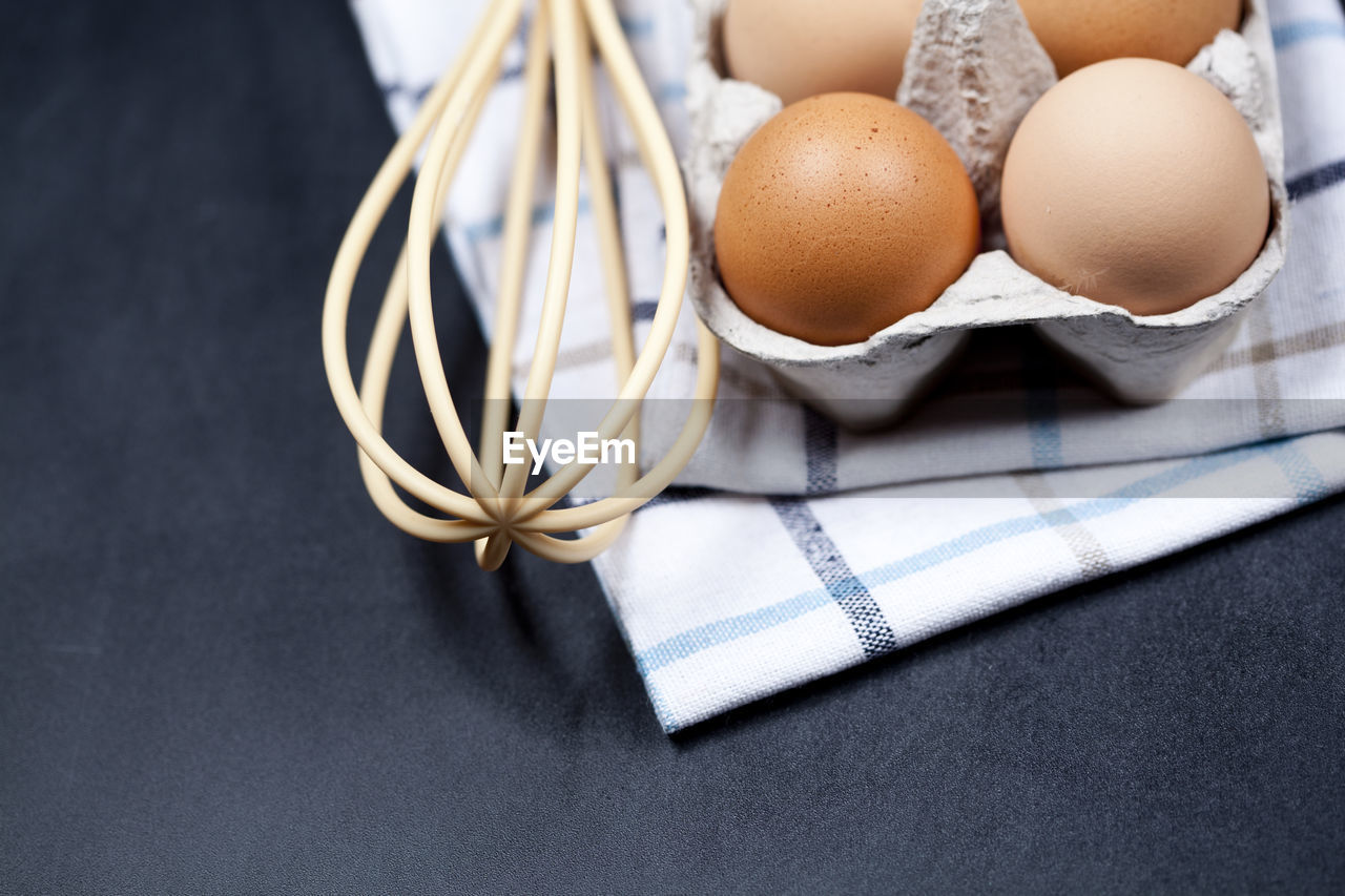 high angle view of brown eggs in plate on table