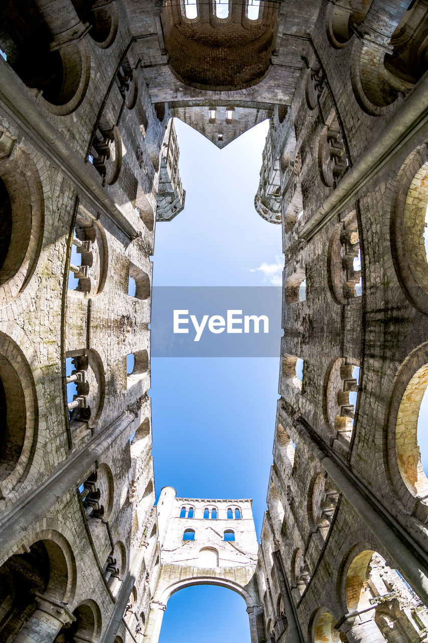 Low angle view of jumieges abbey against sky