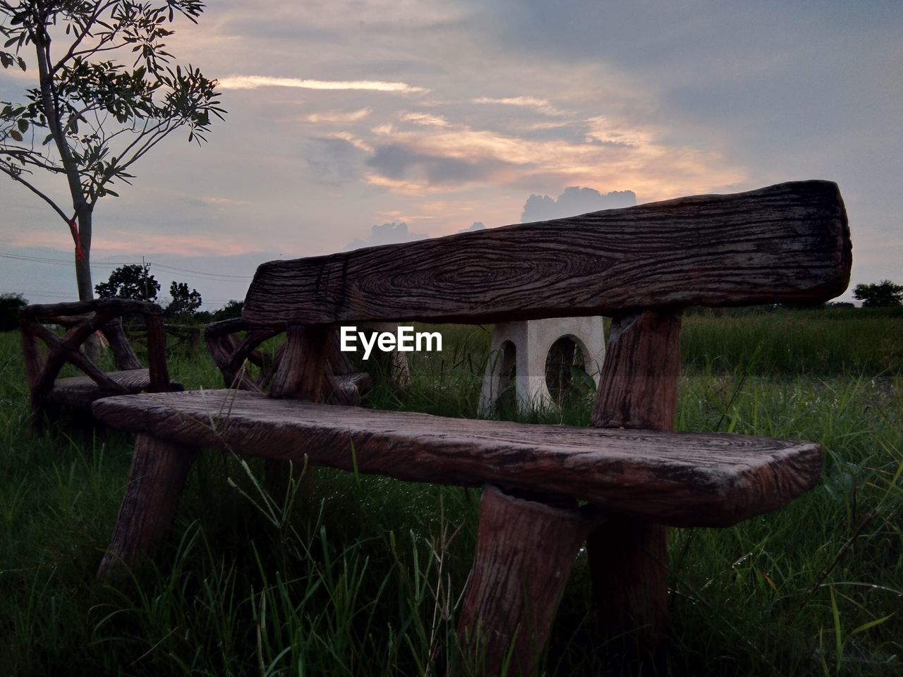 WOODEN FENCE ON FIELD AGAINST SKY