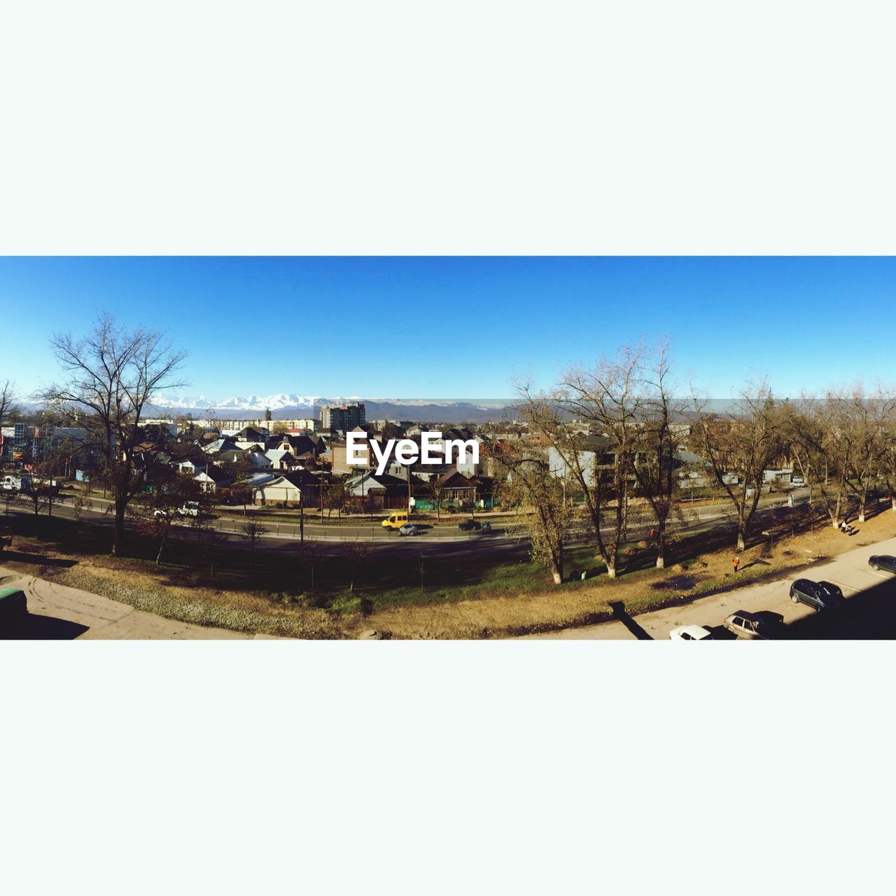 HOUSES ON LANDSCAPE AGAINST CLEAR SKY