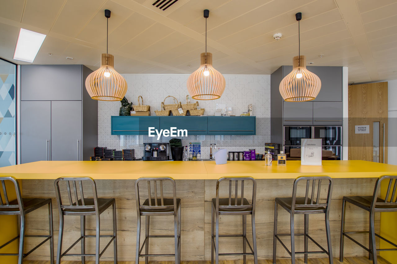 Empty chairs and tables in cafe