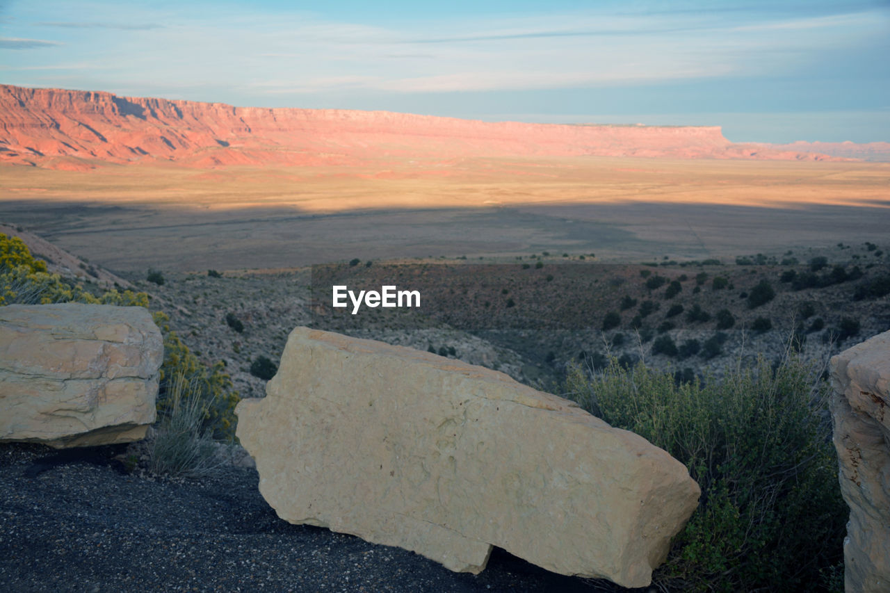 Scenic view of landscape against cloudy sky