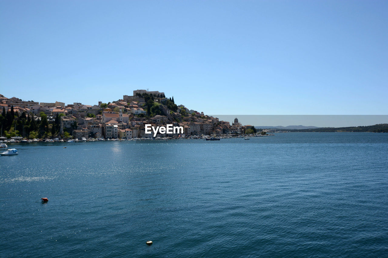 Piran by sea against clear sky