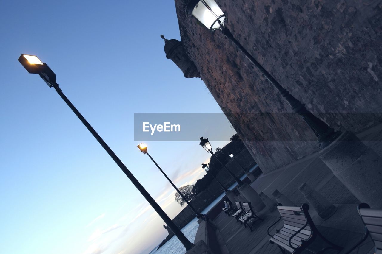 LOW ANGLE VIEW OF STREET LIGHTS AGAINST SKY