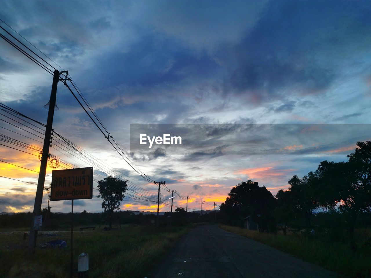 ROAD AGAINST SKY AT SUNSET