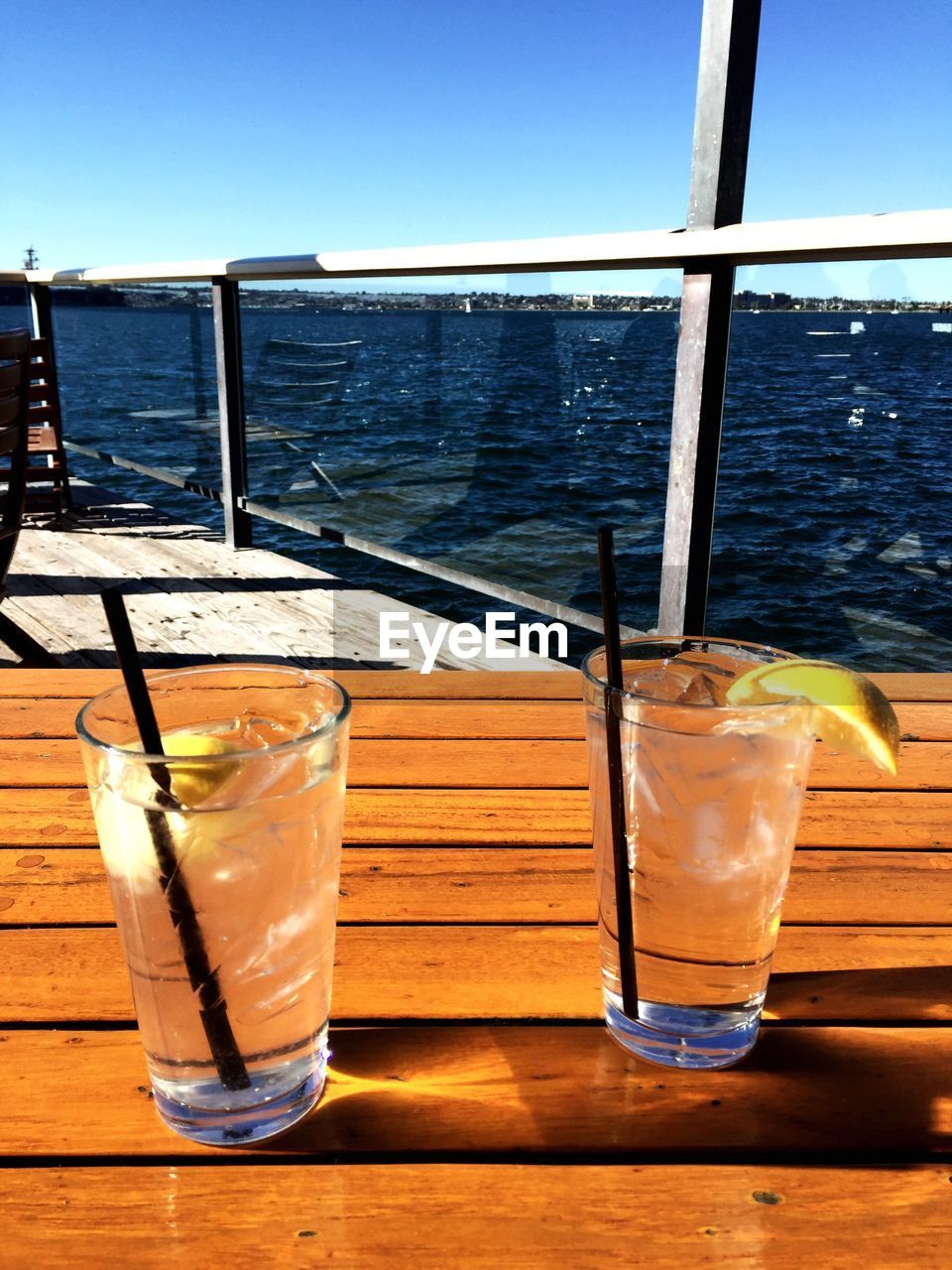 Close-up of fresh lemonade served on table at restaurant on pier