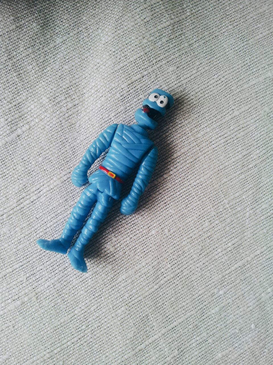 High angle view of plastic toy on bed