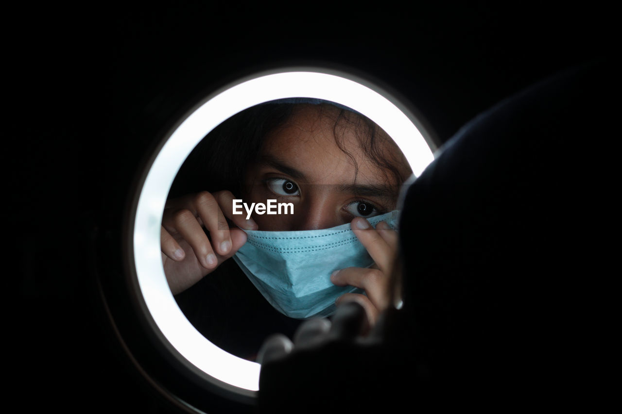 Close-up portrait of girl wearing mask during quarantine. 