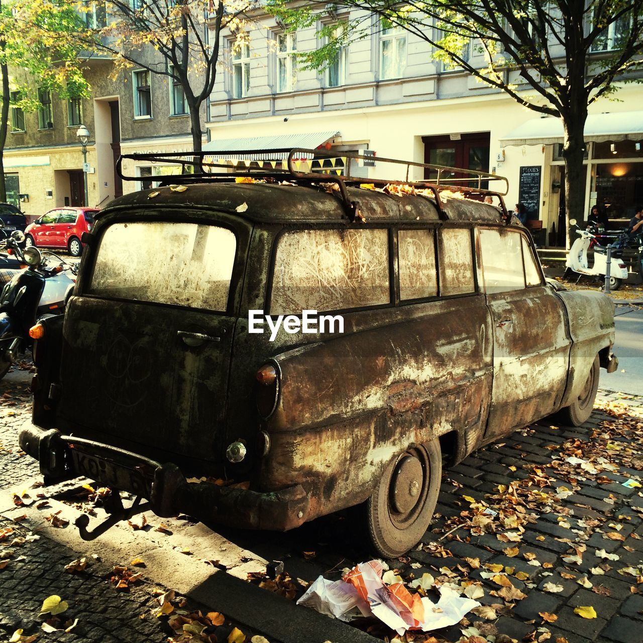 Obsolete vintage car on sidewalk