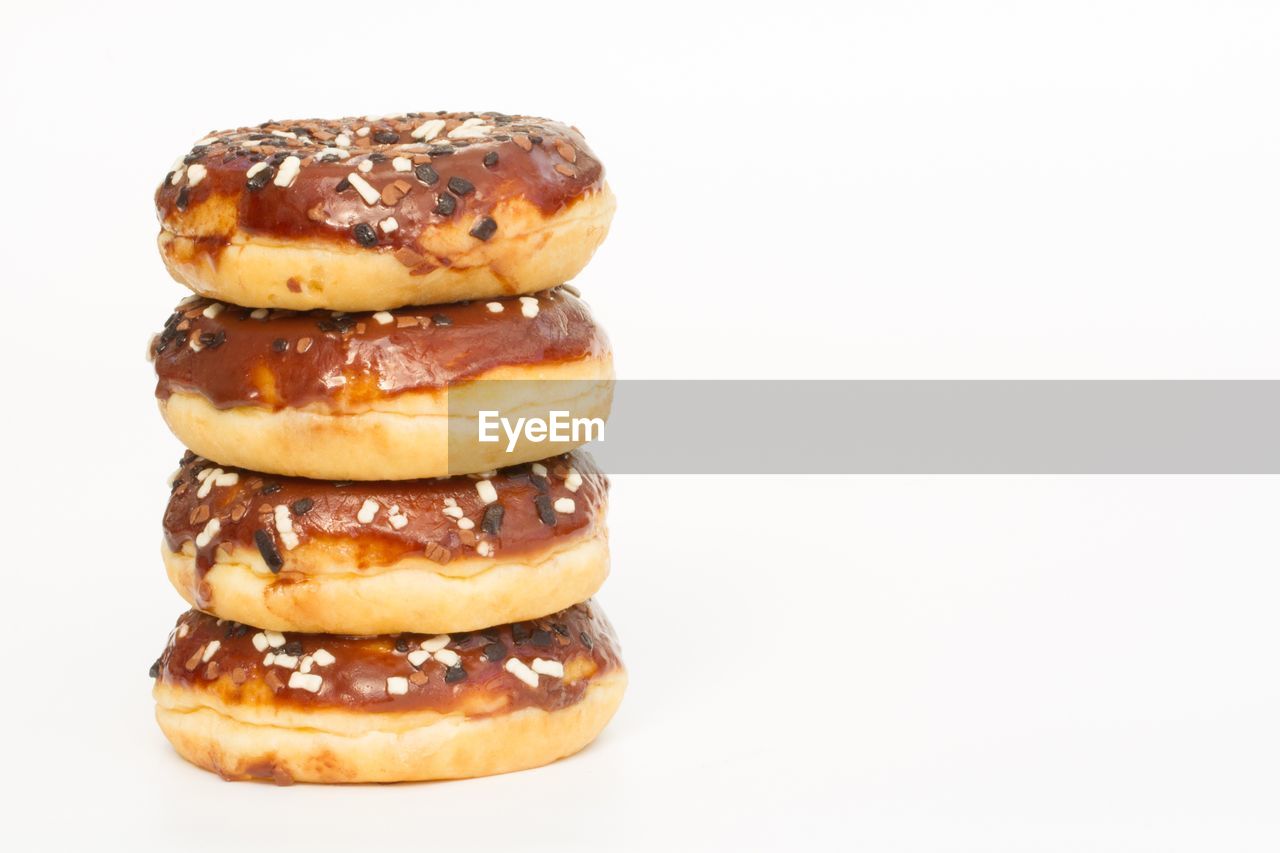 Stack of donuts against white background