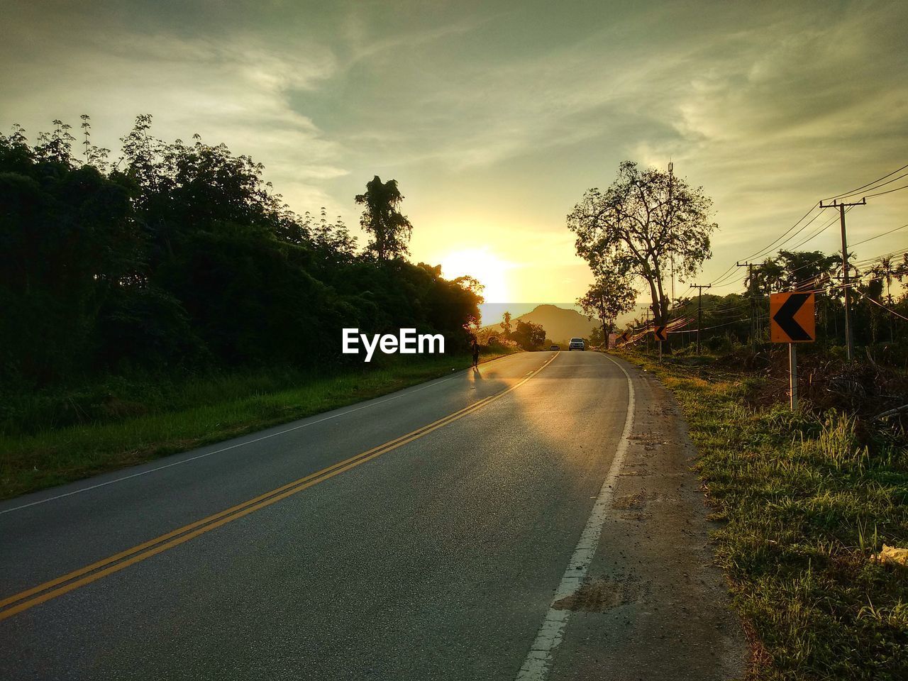 ROAD AGAINST SKY DURING SUNSET