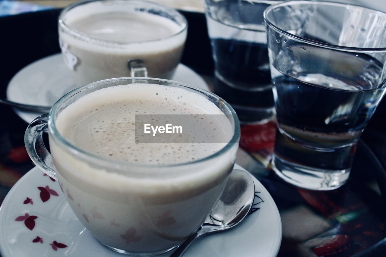 High angle view of coffee cups on table