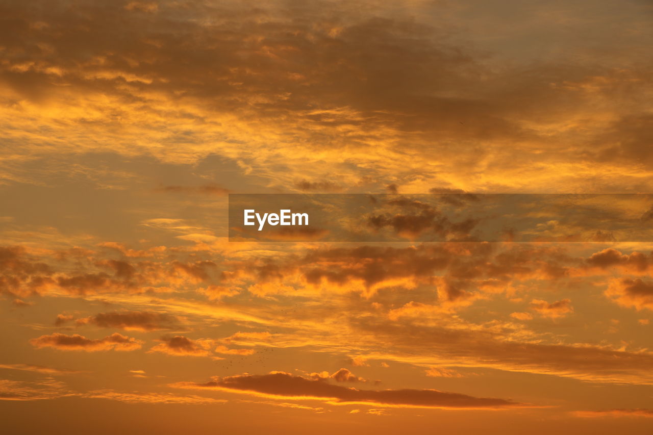 Low angle view of dramatic sky during sunset