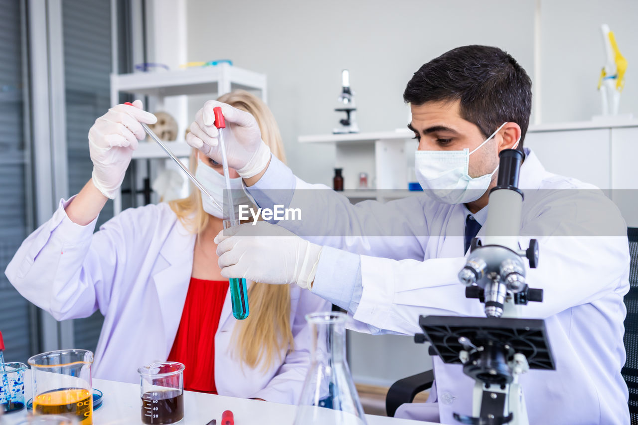 Scientist wearing man working in laboratory