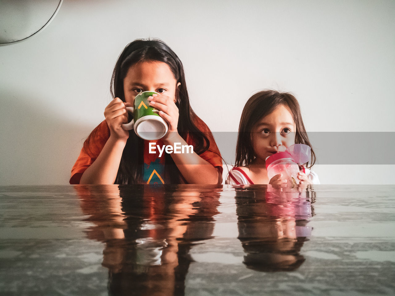 Portrait of a girl drinking water