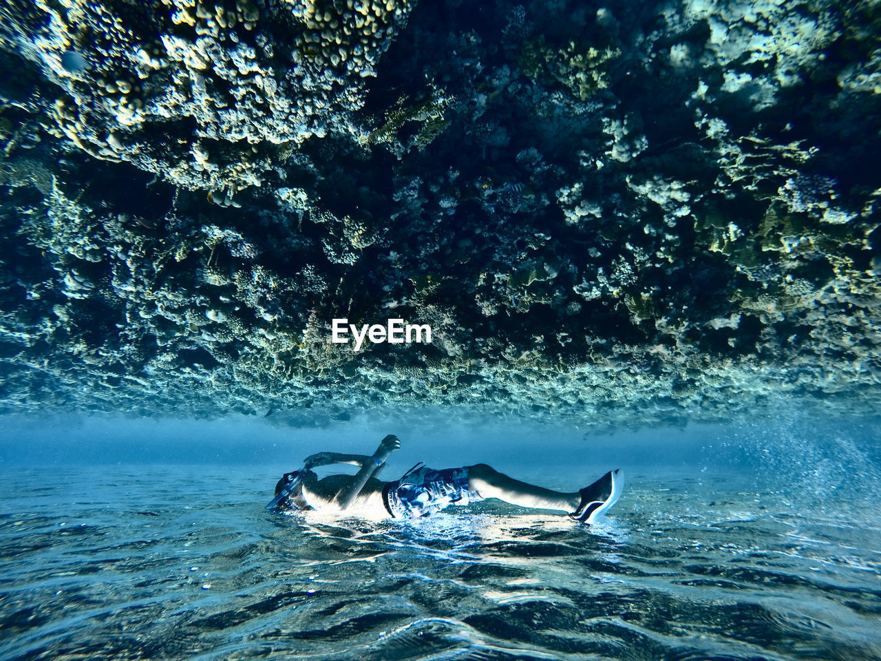 YOUNG MAN SWIMMING IN SEA