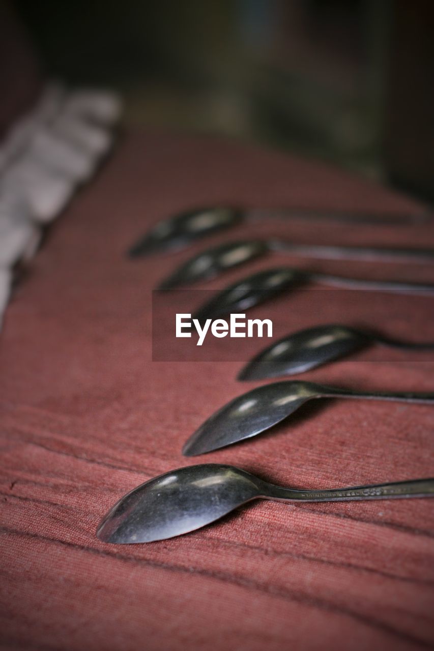 CLOSE-UP OF FORK ON TABLE