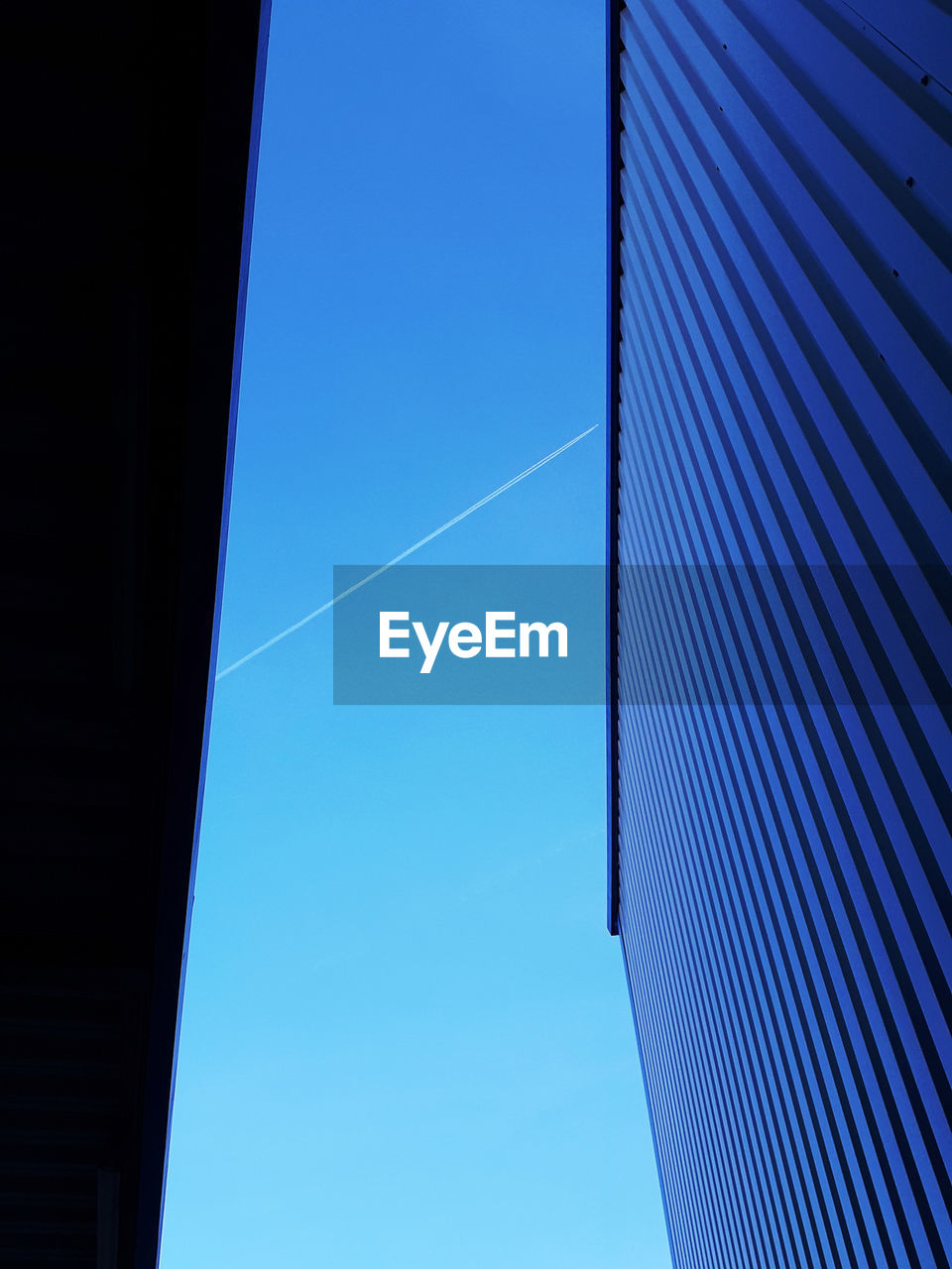 Low angle view of building against blue sky