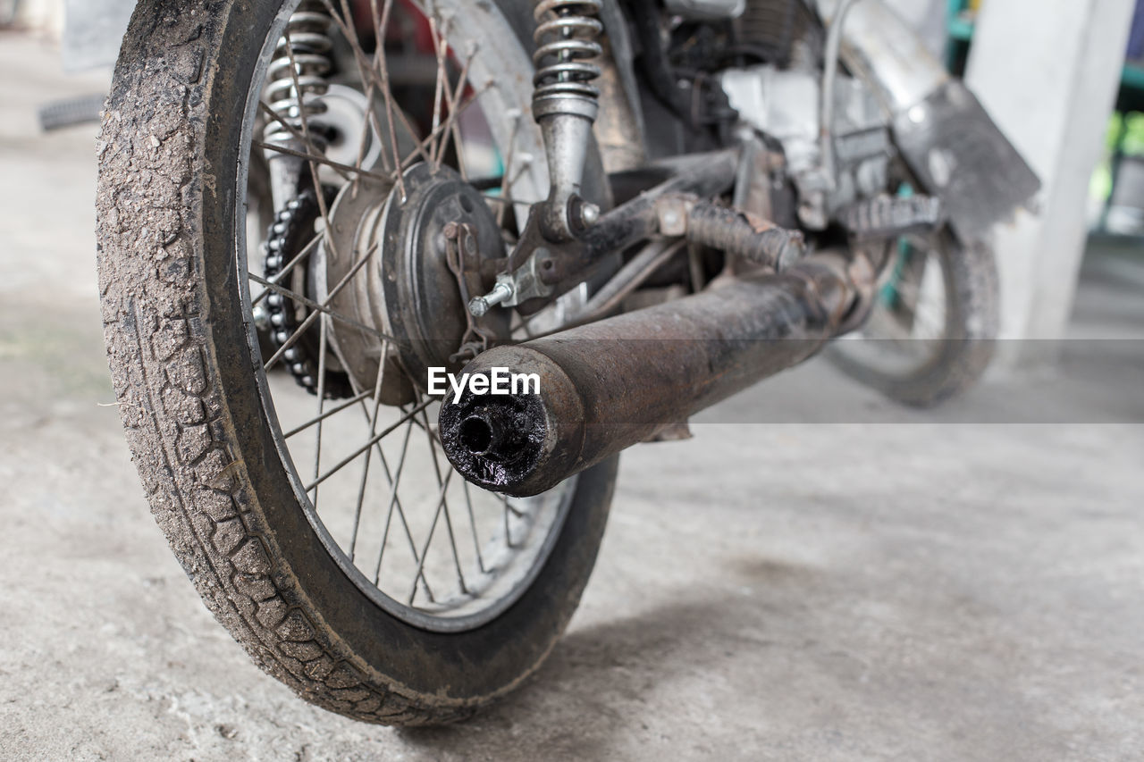 CLOSE-UP OF BICYCLE ON ROAD