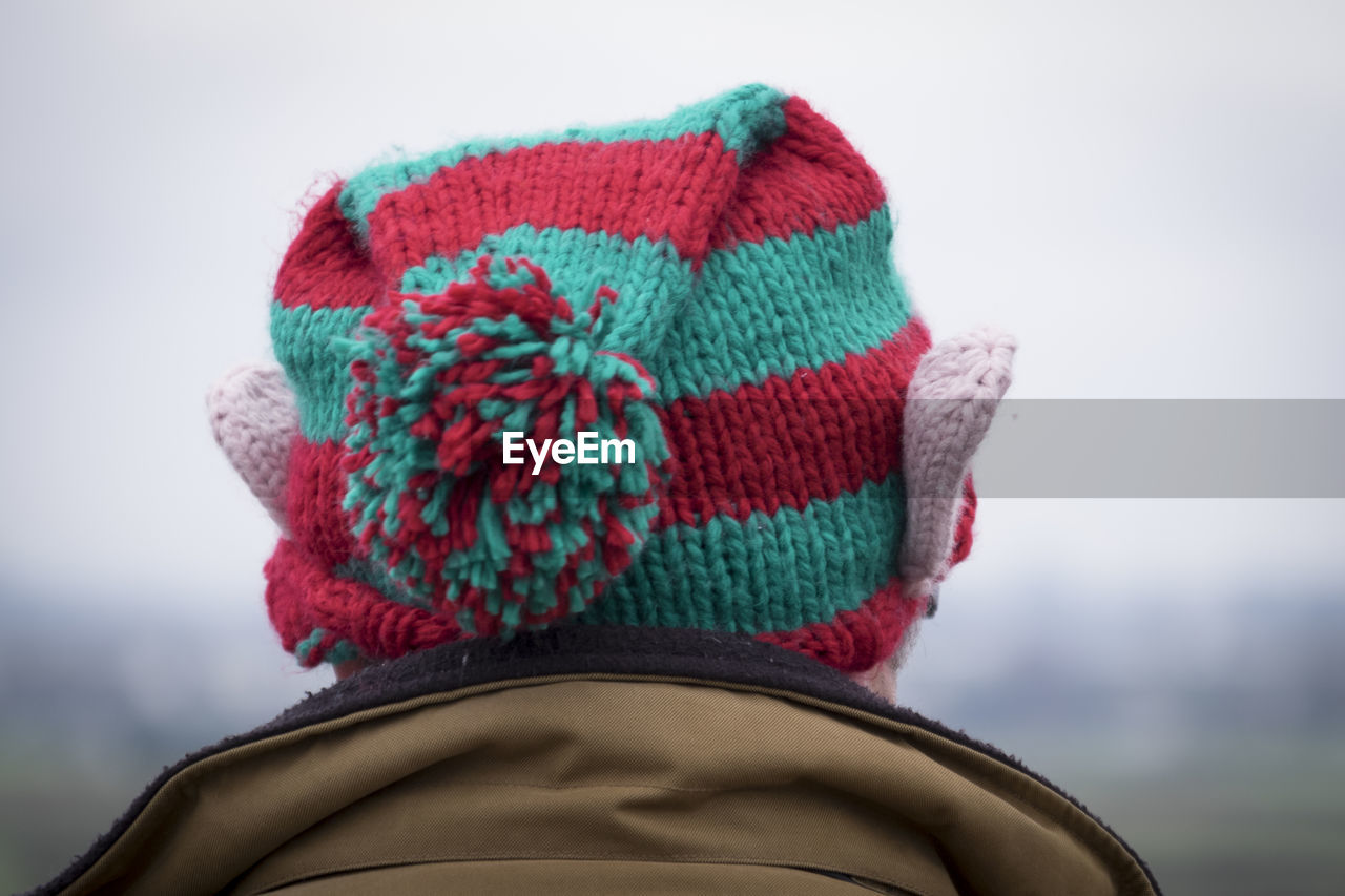 Close-up of man wearing knitted hat