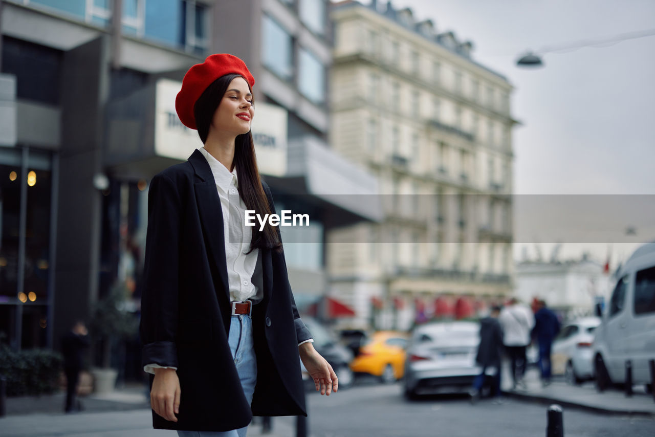 portrait of young woman standing on street