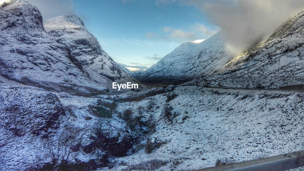 Scenic view of snowcapped mountains against sky