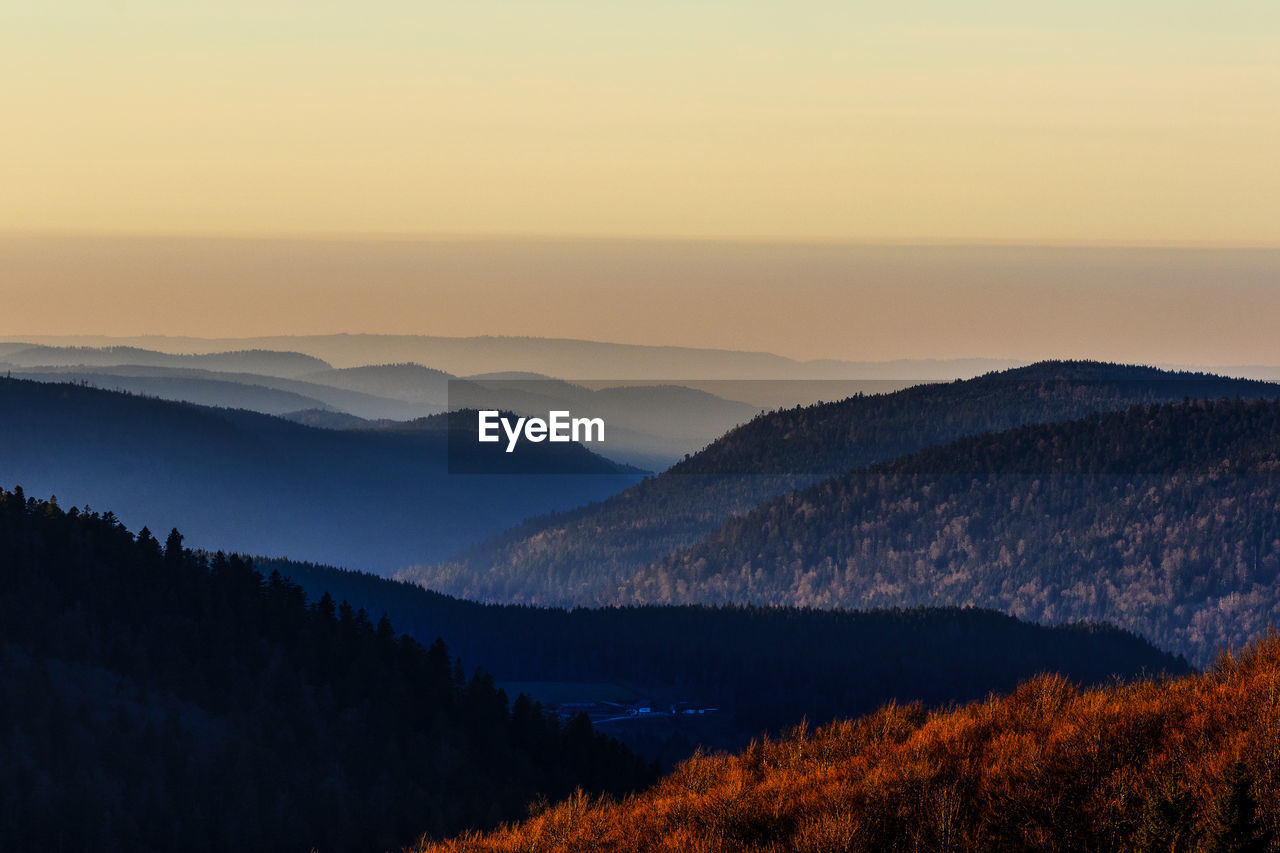 SCENIC VIEW OF MOUNTAIN RANGE AGAINST SKY DURING SUNSET