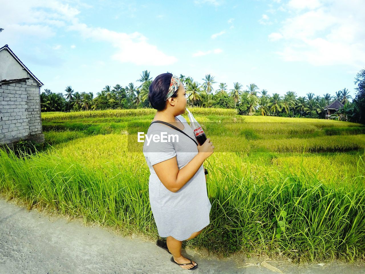 WOMAN STANDING ON FIELD