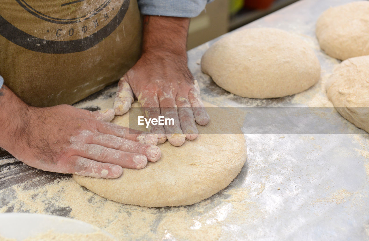 Close-up of man preparing food