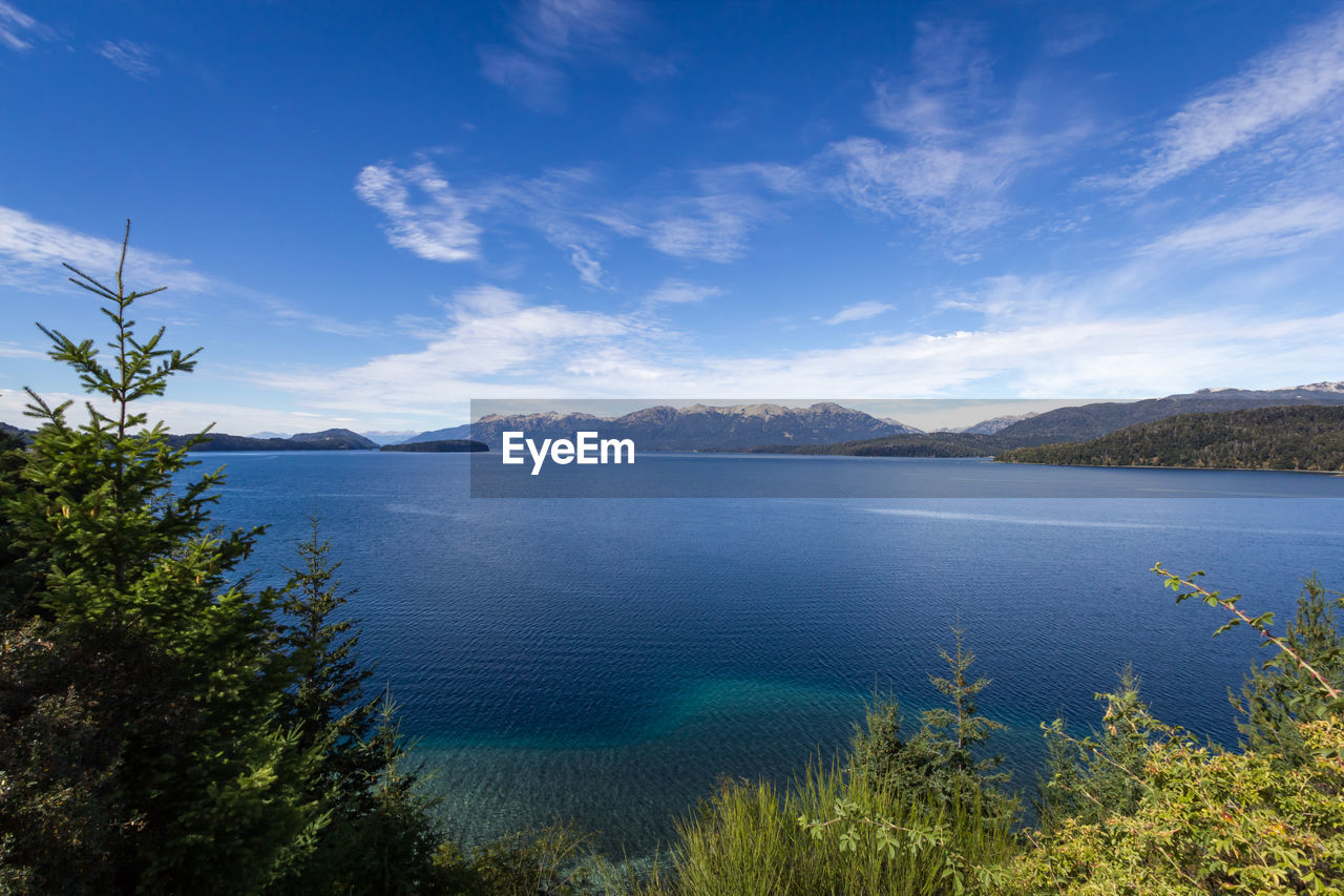 Scenic view of lake against blue sky
