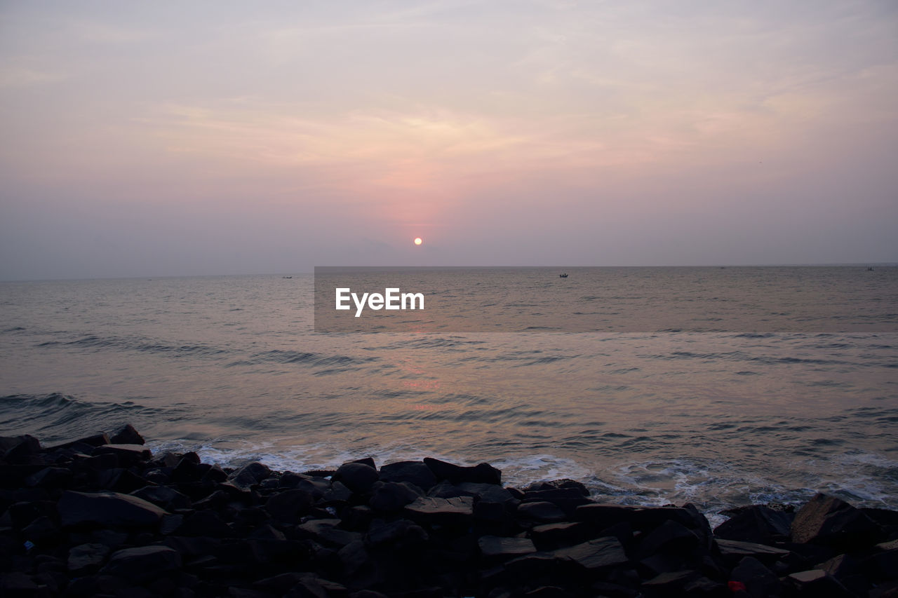 SCENIC VIEW OF SEA DURING SUNSET