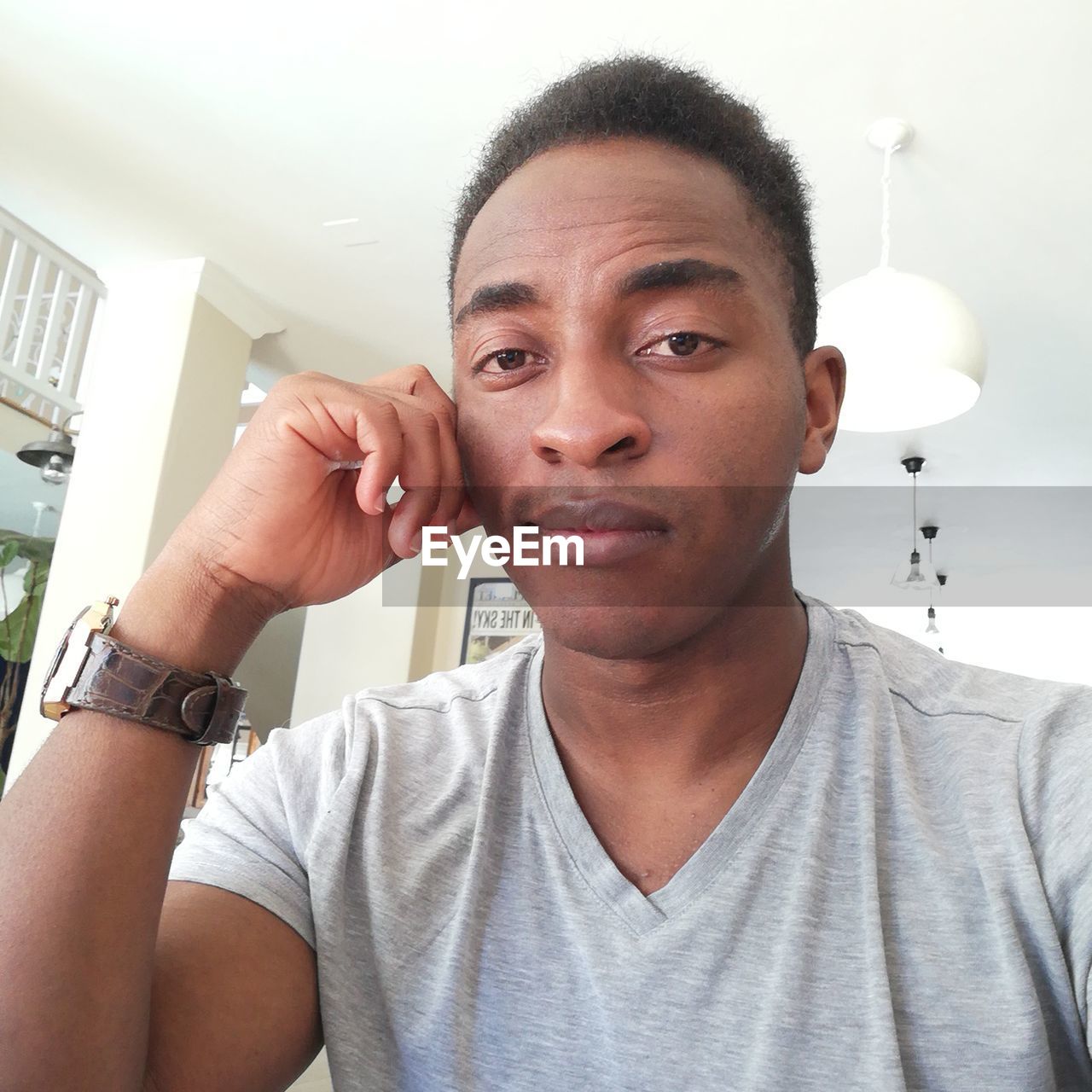 Close-up portrait of young african man at home