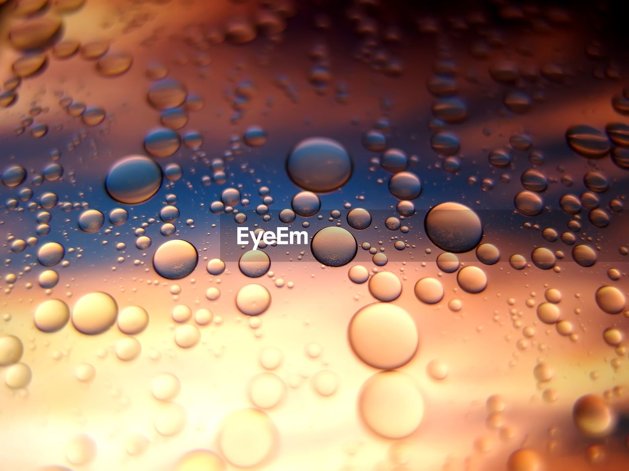 FULL FRAME SHOT OF WATER DROPS ON YELLOW