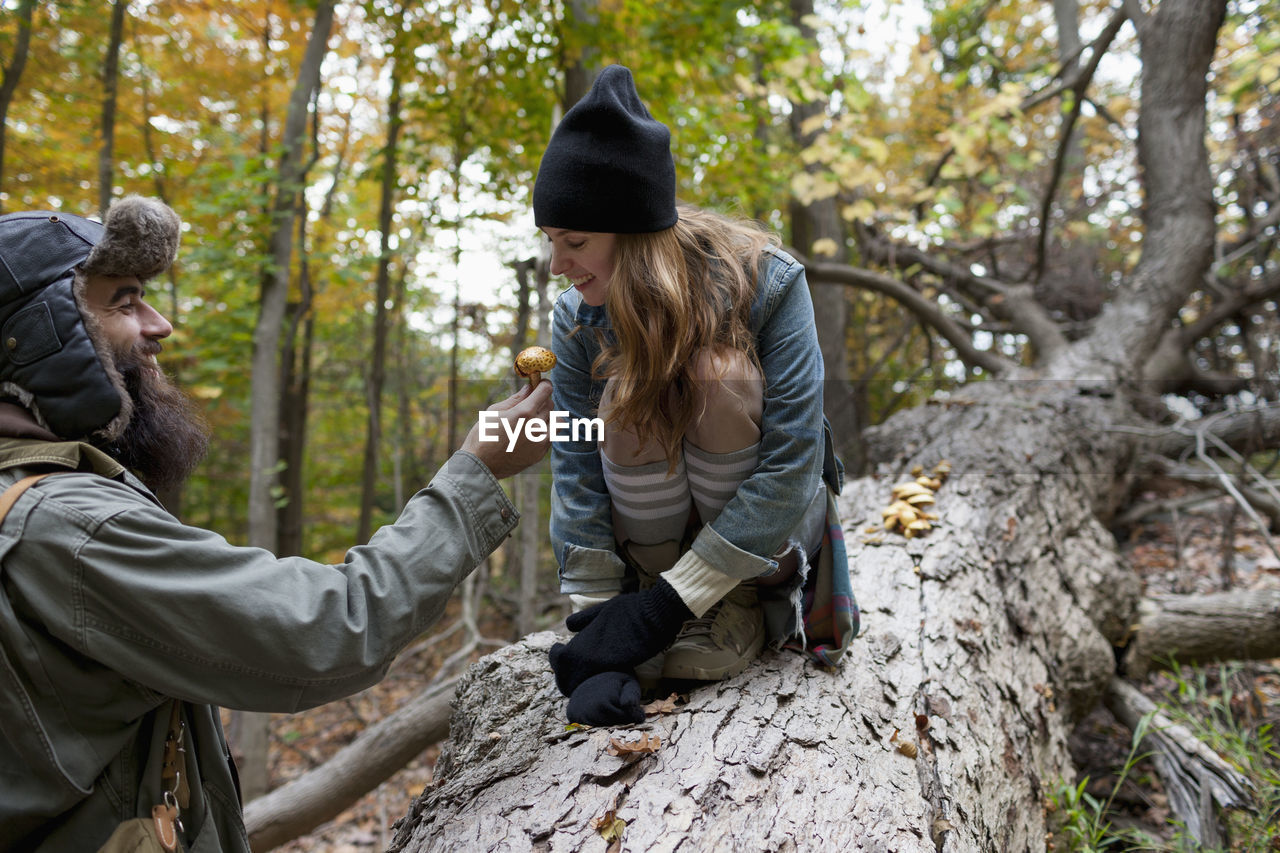 Young couple hanging out in the forest