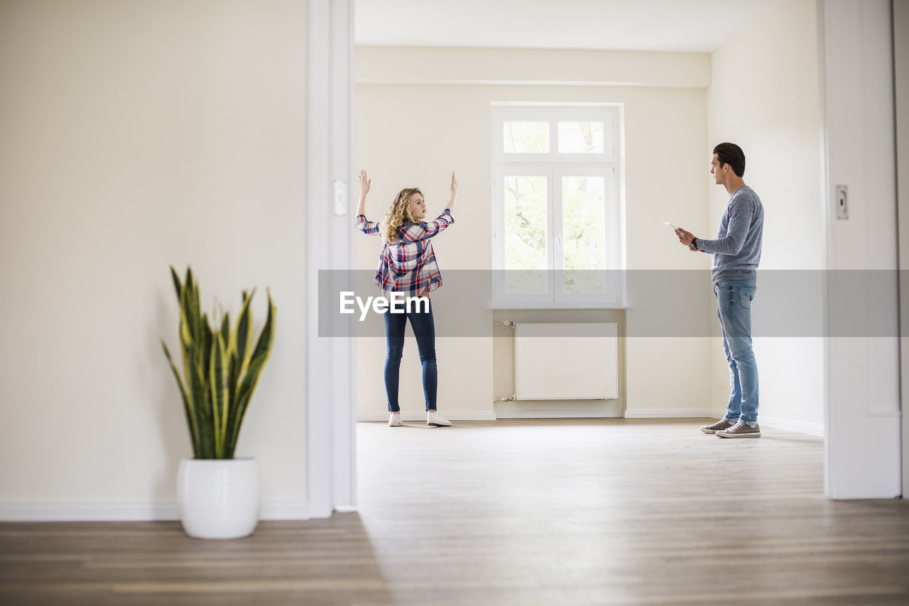 Young couple in new home discussing