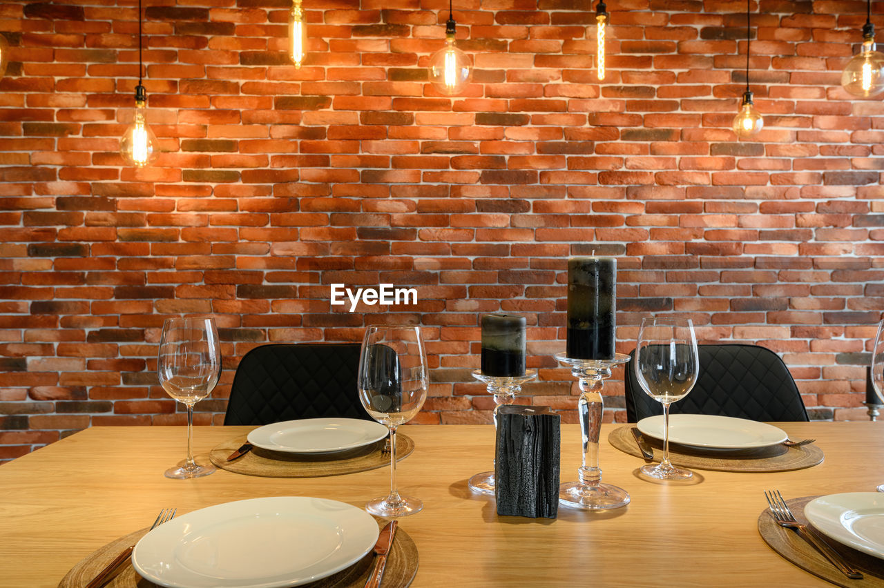 Close-up of wine glasses on table