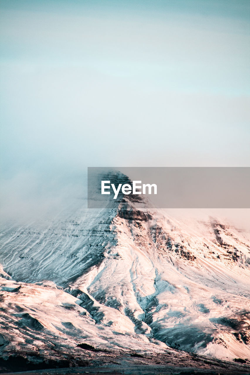 Scenic view of snow covered mountain against sky in iceland