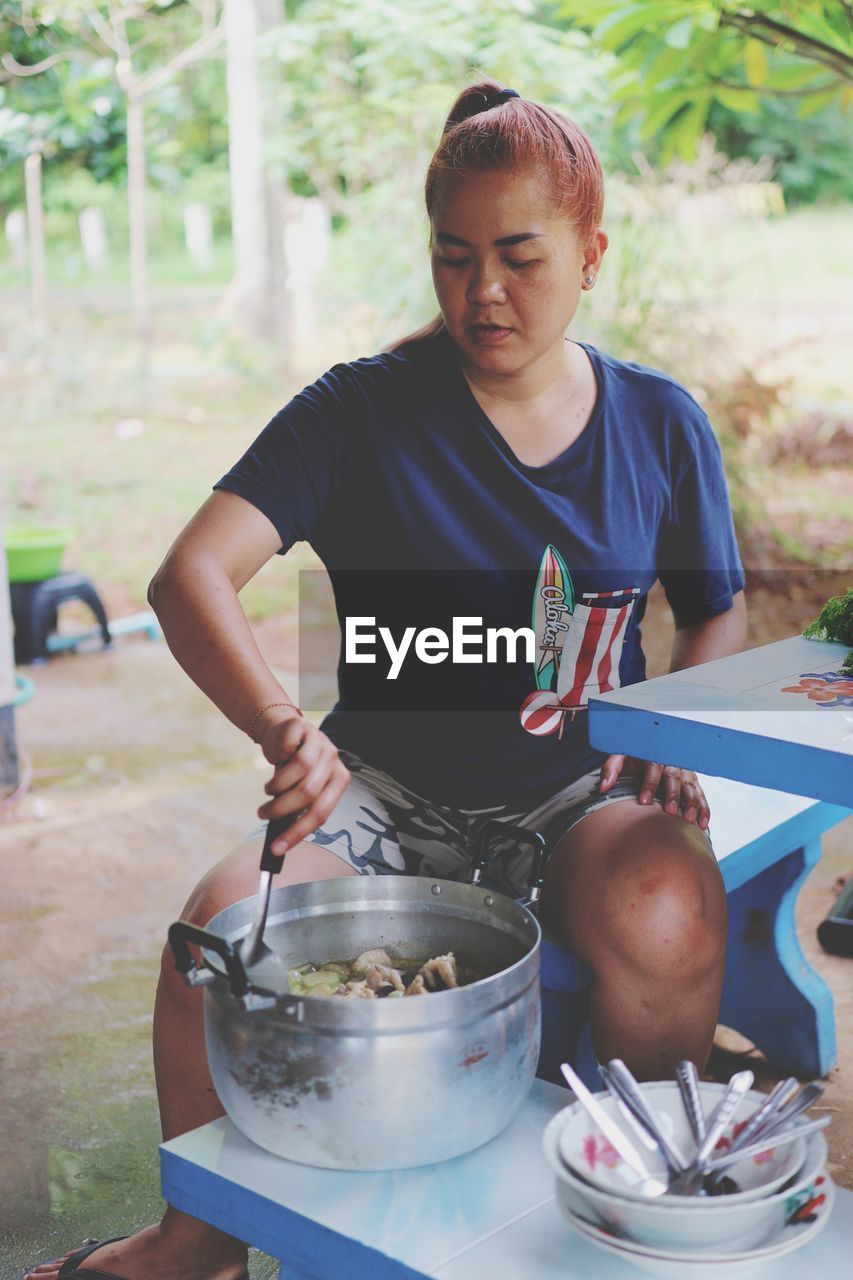 Woman preparing food on table